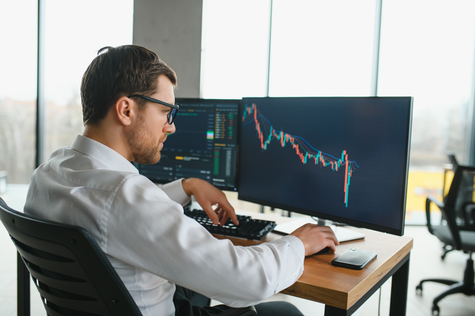 Successful trader in formalwear checking cryptocurrency information data on finance market